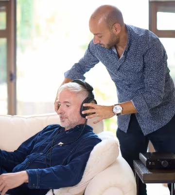 Photo of team members with headphones